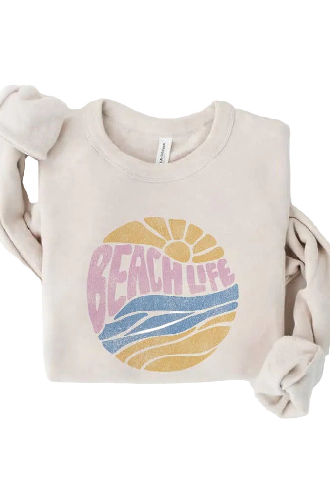 Beige sweatshirt with 'Beach Life' graphic design on a white background