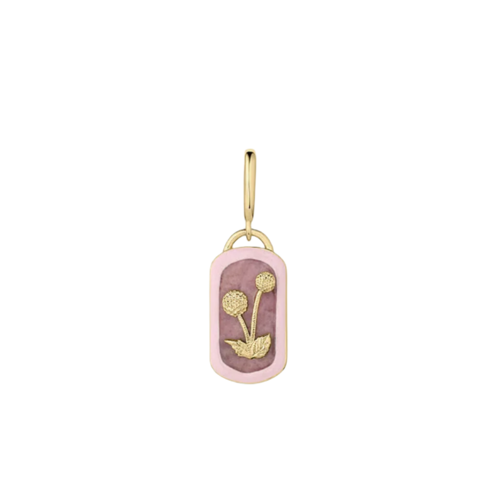 Gold and pink pendant with floral design on a white background