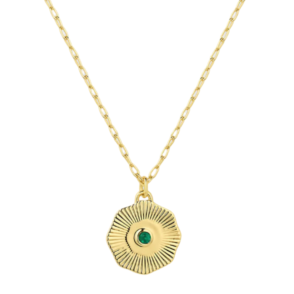 Gold necklace with a green gemstone pendant on a white background