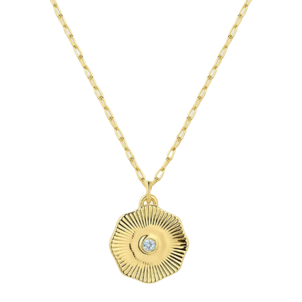 Gold necklace with a circular pendant on a white background