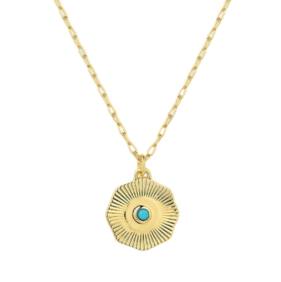 Gold necklace with a circular pendant featuring a blue gemstone on a white background