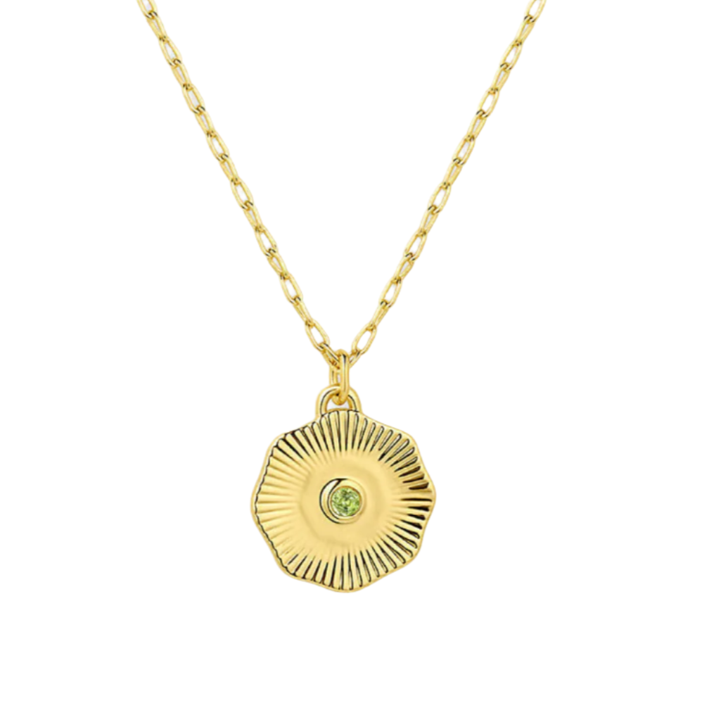 Gold necklace with a circular pendant on a white background