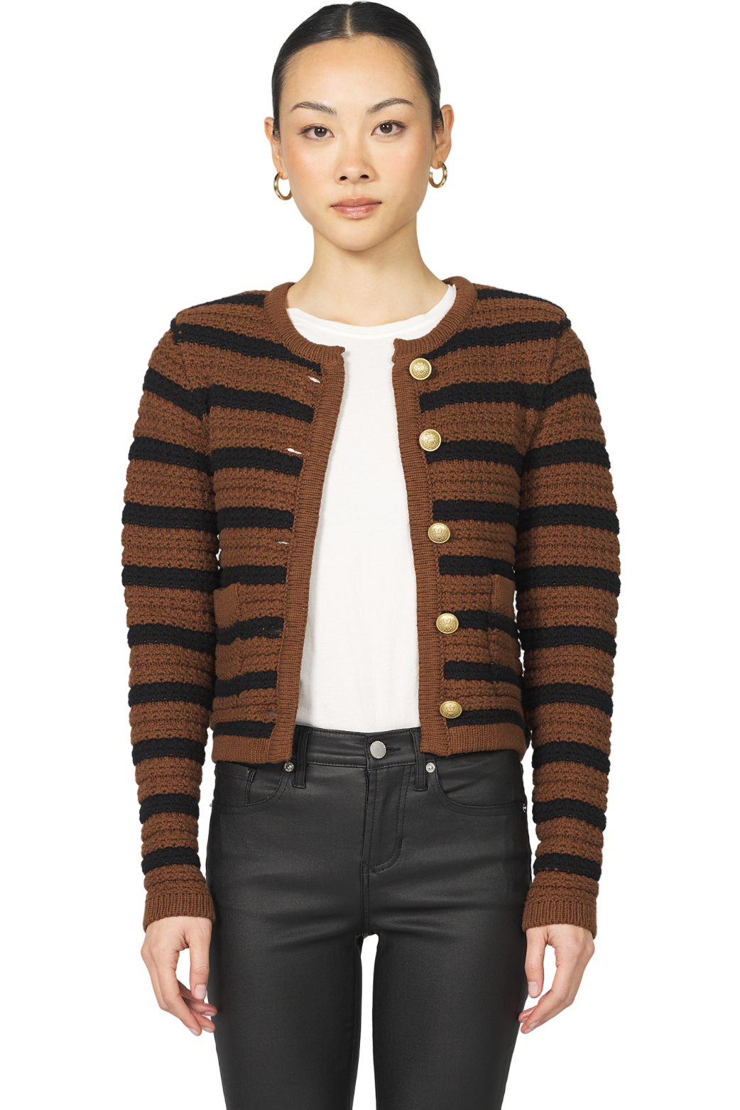 Woman wearing a brown and black striped cardigan on a white background
