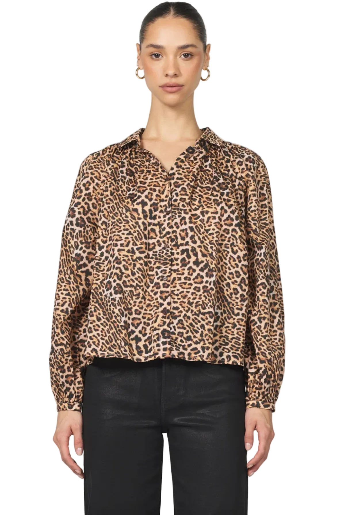 Woman wearing a leopard print blouse against a white background