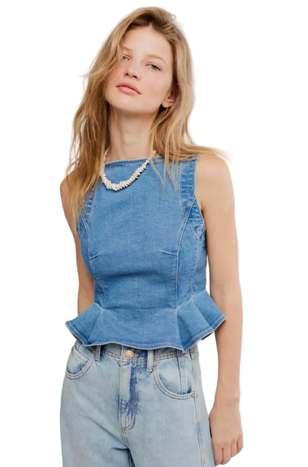 Woman wearing Free People Sunfaded Denim Top with fitted peplum silhouette, lightweight denim fabric, and pleated detailing.