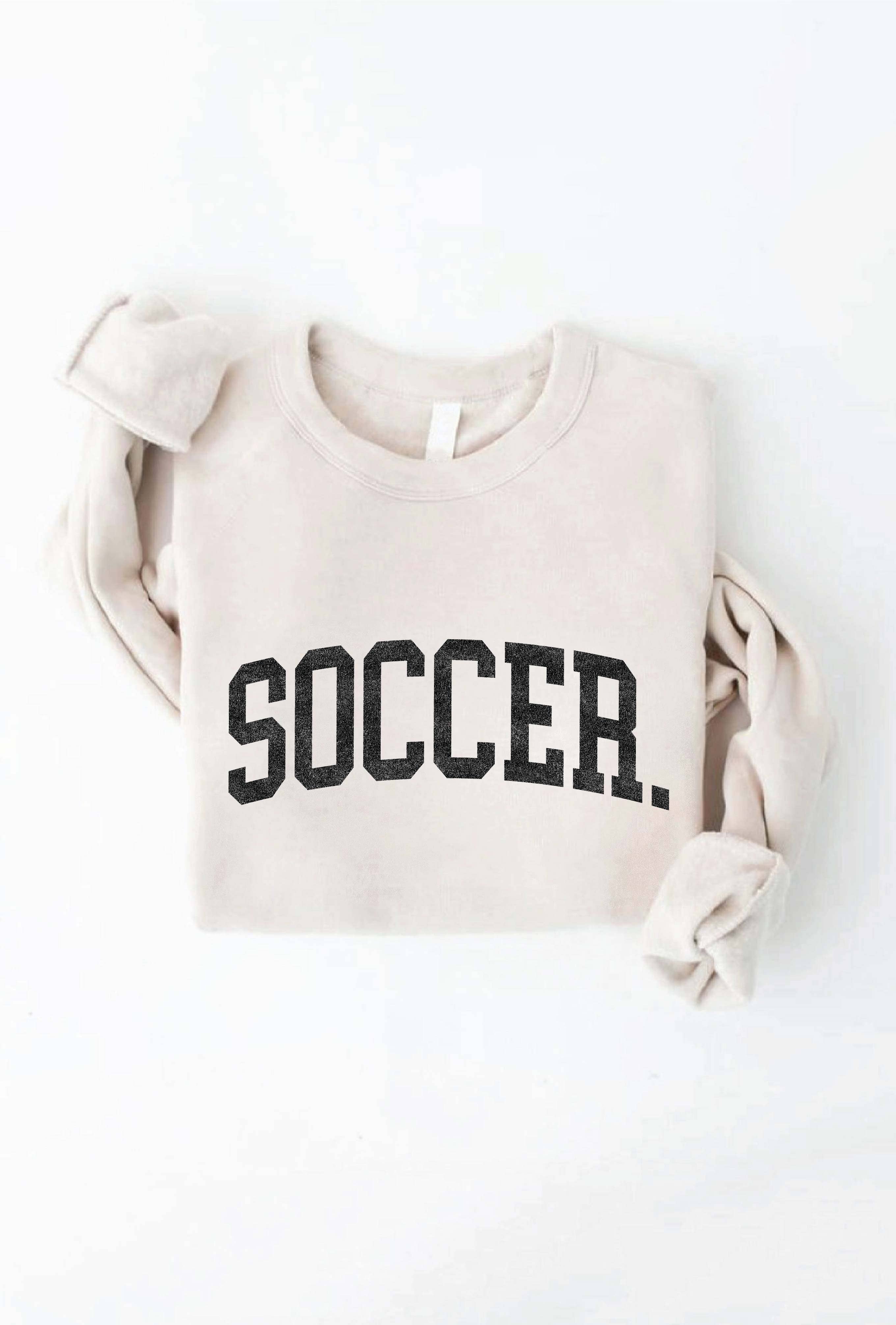 Beige sweatshirt with 'SOCCER.' text on a white background