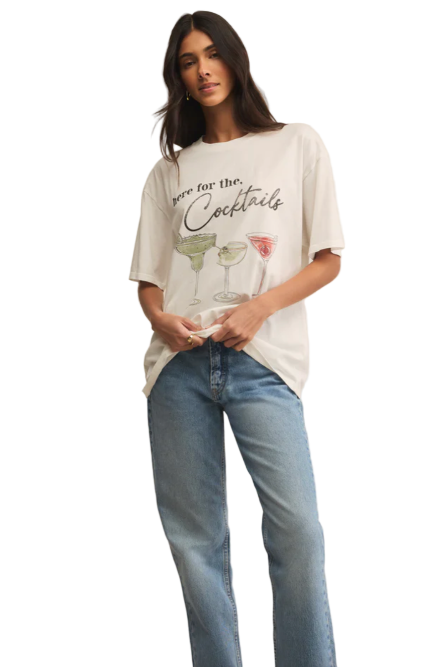 Woman wearing a white t-shirt with cocktail graphics and text, standing against a white background