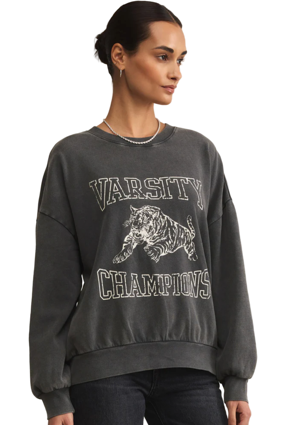 Person wearing a dark gray 'Varsity Champions' sweatshirt with a tiger graphic on a white background