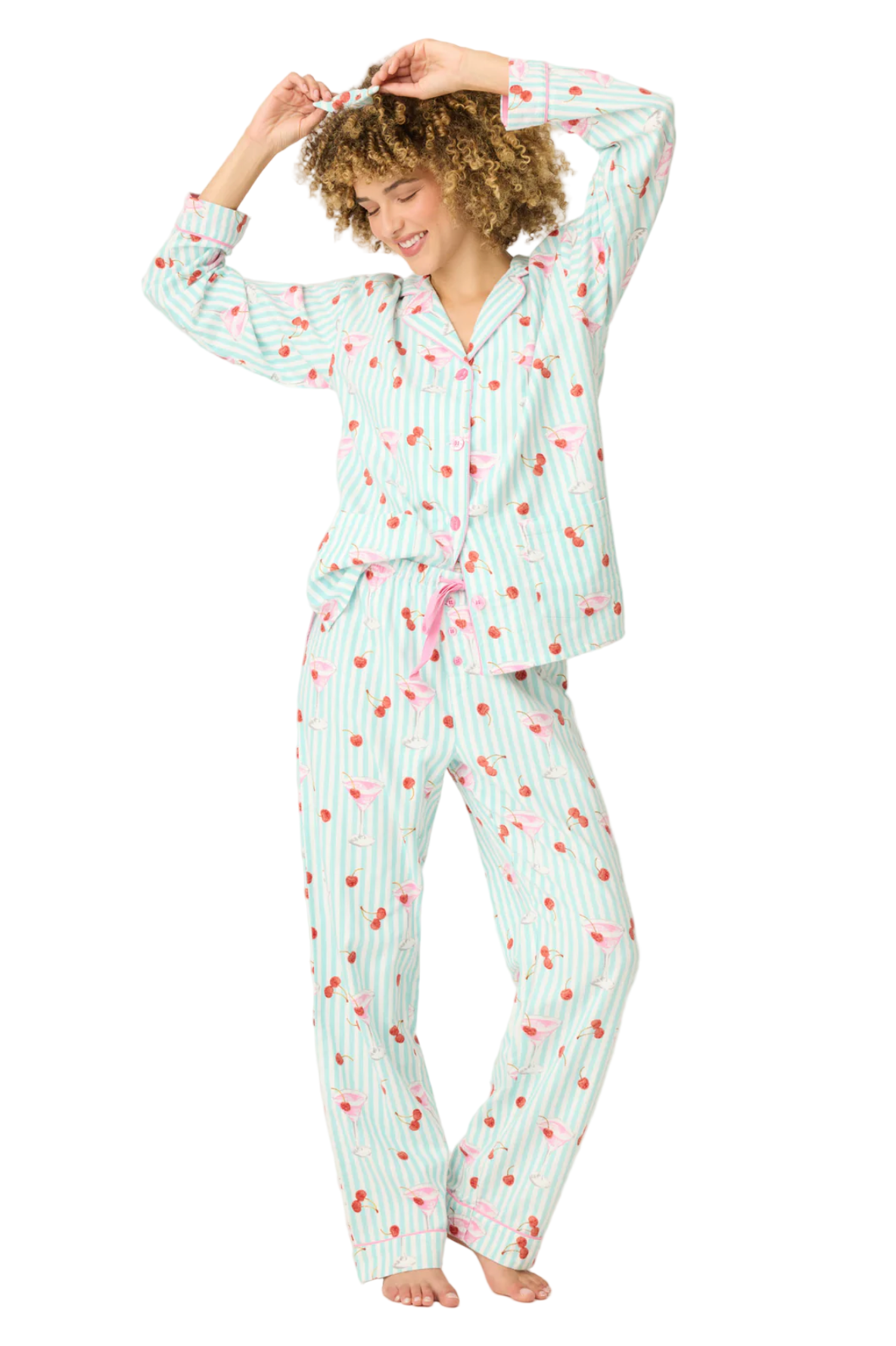 Woman wearing a patterned pajama set on a white background