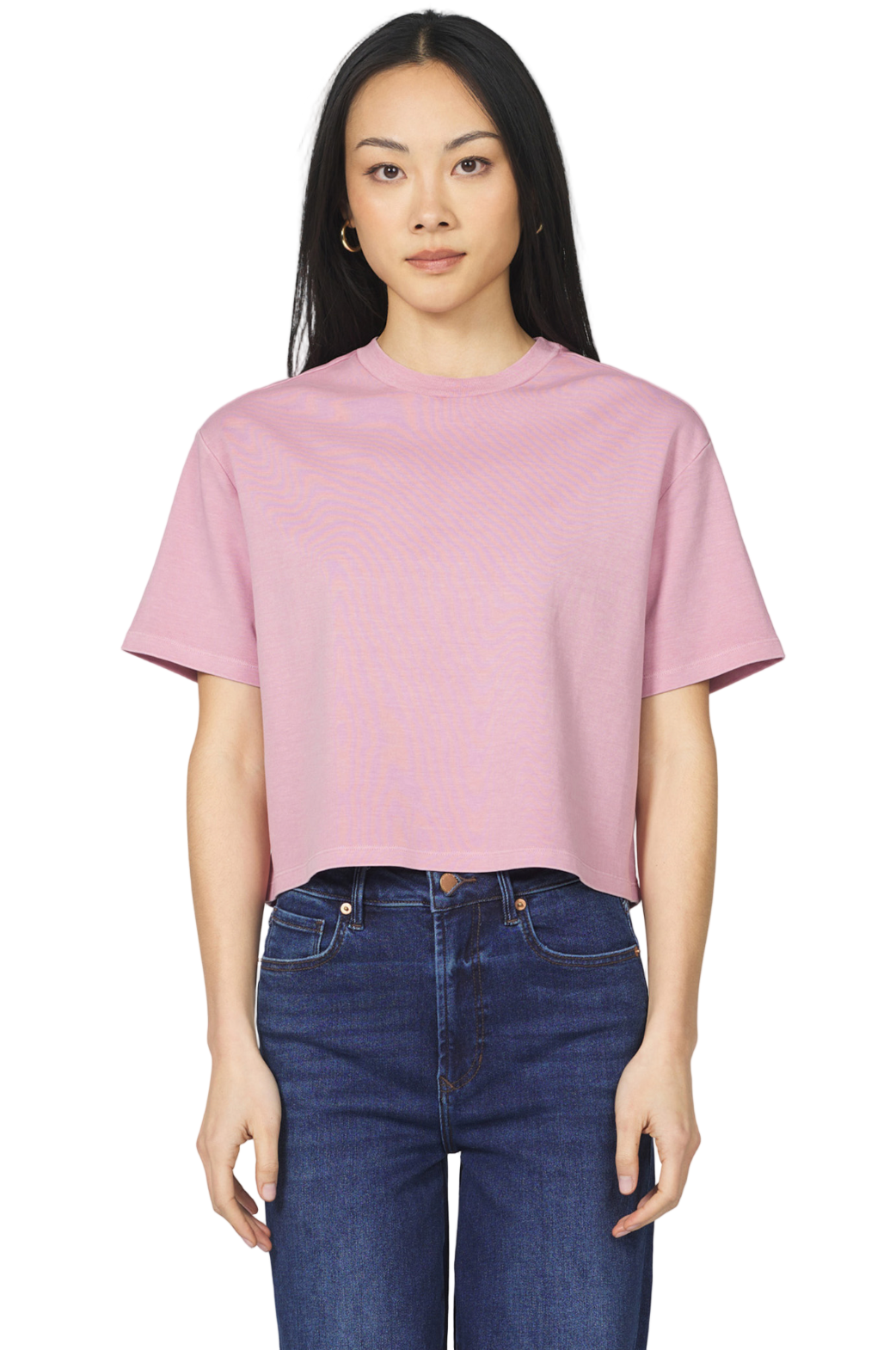 Person wearing a pink t-shirt and blue jeans on a white background