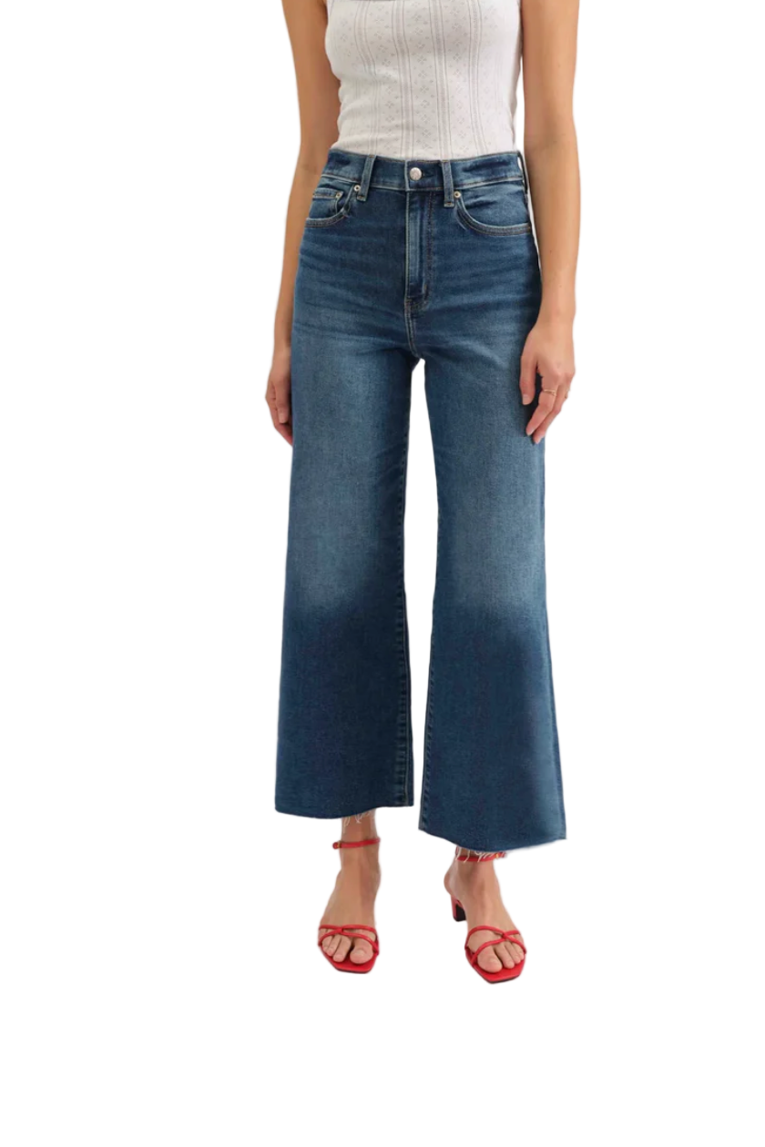 Person wearing blue jeans on a white background