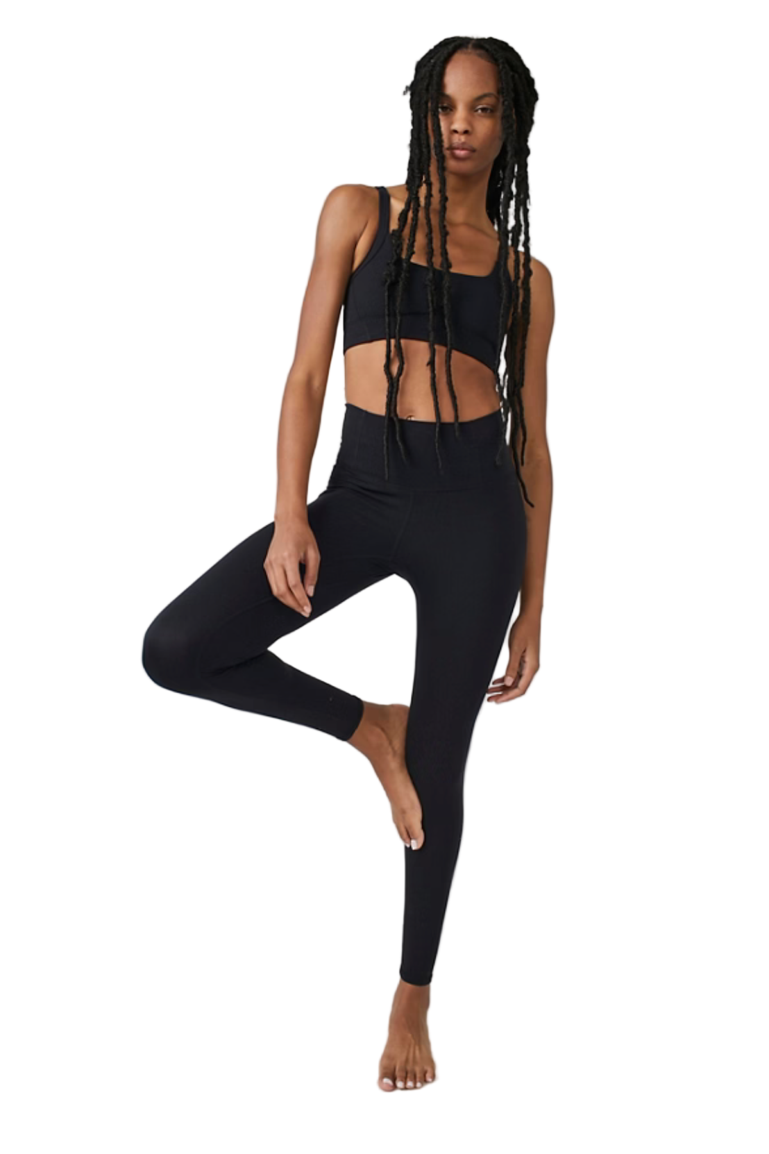 Woman wearing a black athletic outfit on a white background