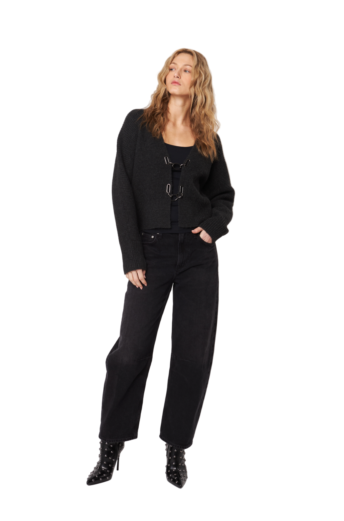 Woman wearing a black outfit with a white background