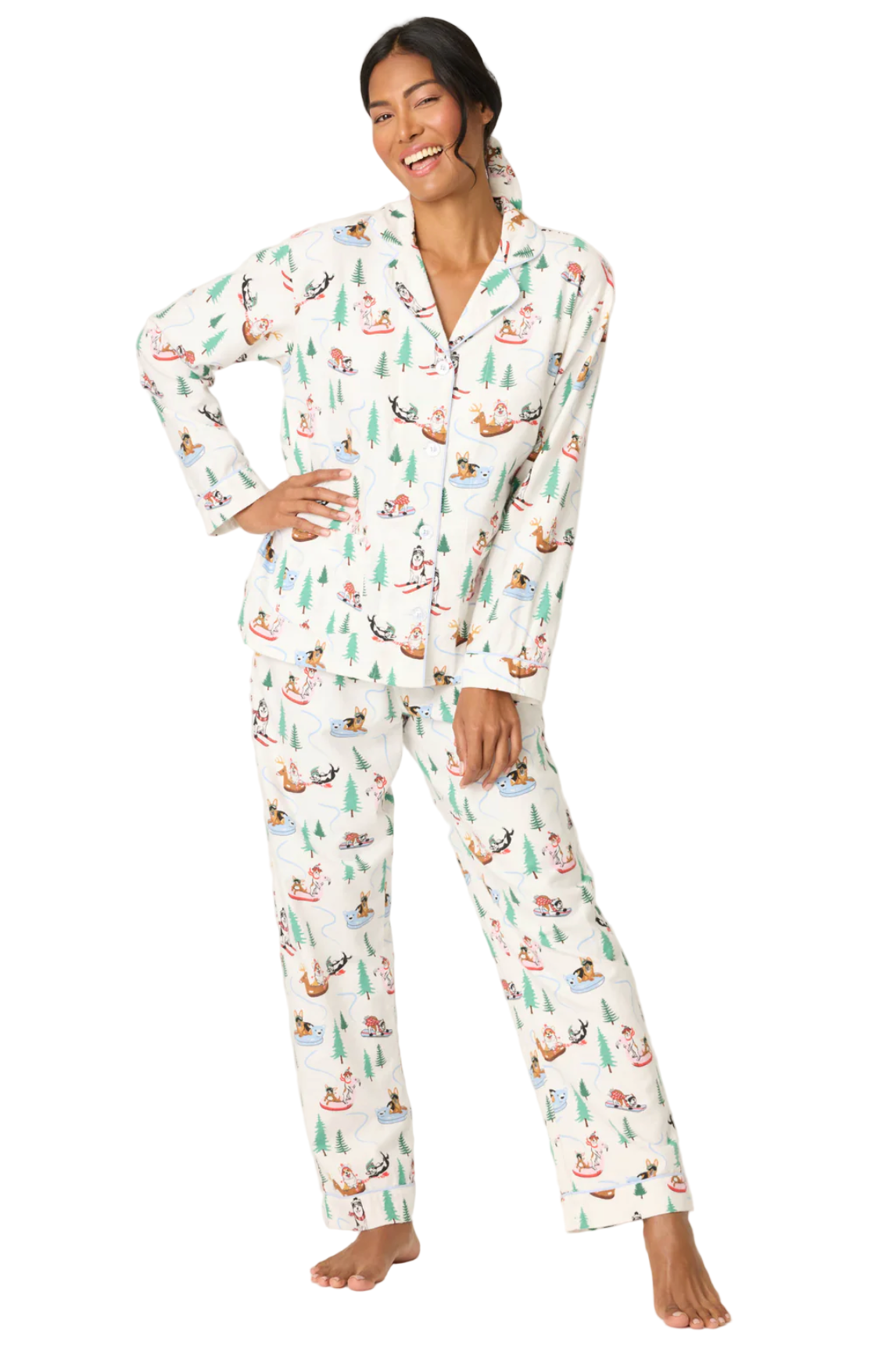 Woman wearing a white pajama set with nature-themed print on a plain background