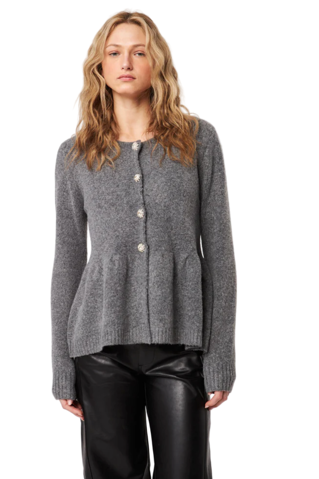 Woman wearing a gray cardigan over black pants on a white background