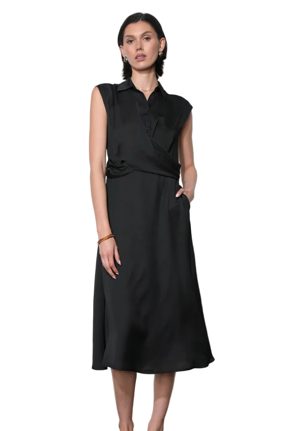 Woman wearing a black sleeveless top and skirt against a white background