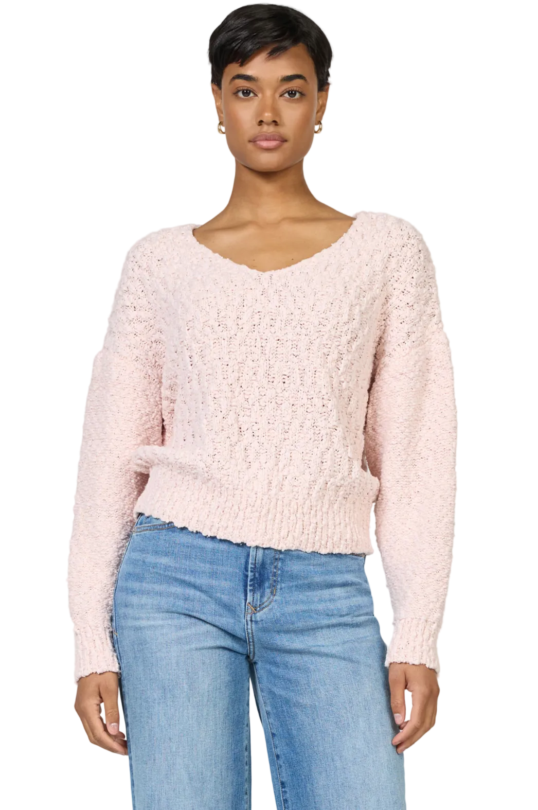 Woman wearing Lexi V-Neck long sleeve sweater in soft soothing yarn with relaxed fit and elegant silhouette