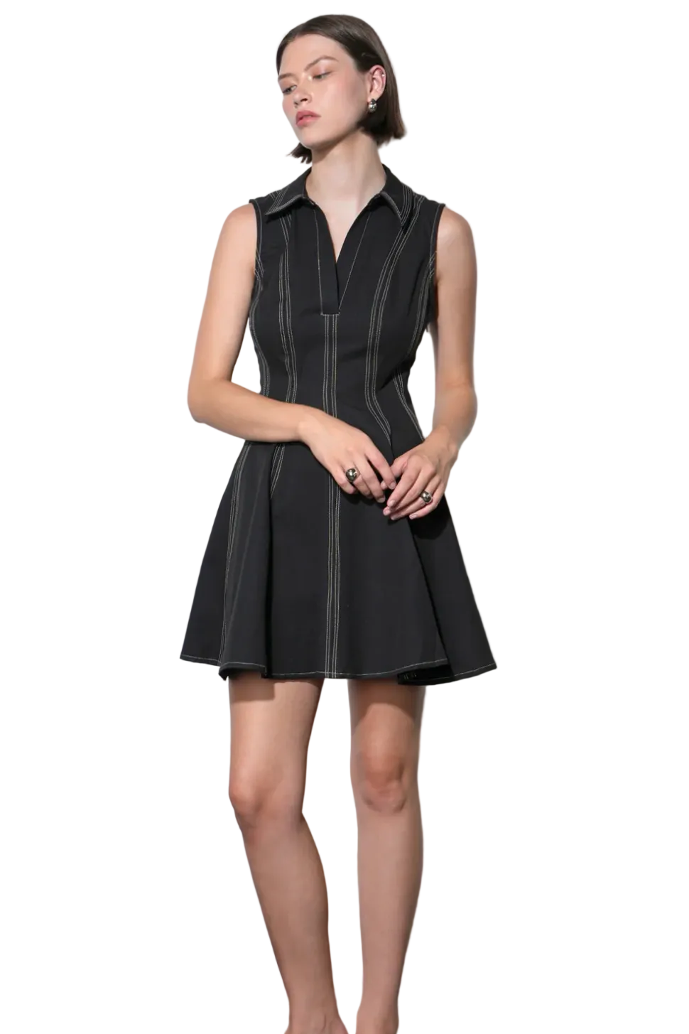 Woman wearing Greylin Sydney Topstitch Flare Mini Dress with a fit-and-flare silhouette and subtle topstitch detailing for a polished look.