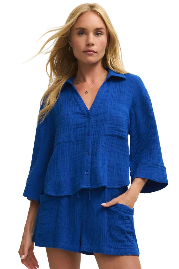 Woman wearing Z Supply Helena Airy Gauze Button Up in lightweight textured cotton with a relaxed fit, collared neckline, and three-quarter sleeves.